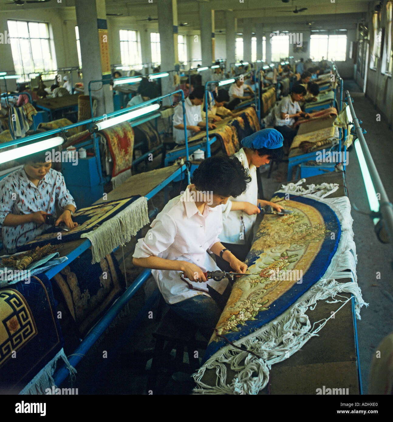 Making Chinese carpets in a factory near Peking Beijing is a valuable part of Chinese export to the west Stock Photo