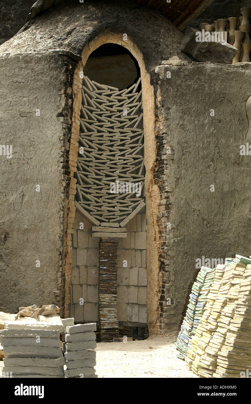 A stack of tiles for firing above the kiln at the ceramic clay works in Fes Morocco Stock Photo