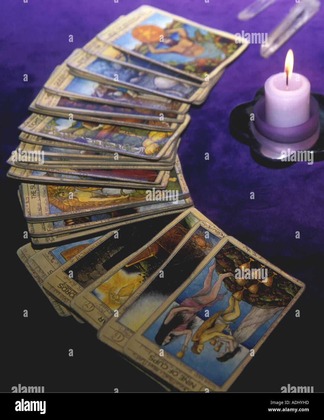 Tarot cards laid out with a candle and crystal Stock Photo