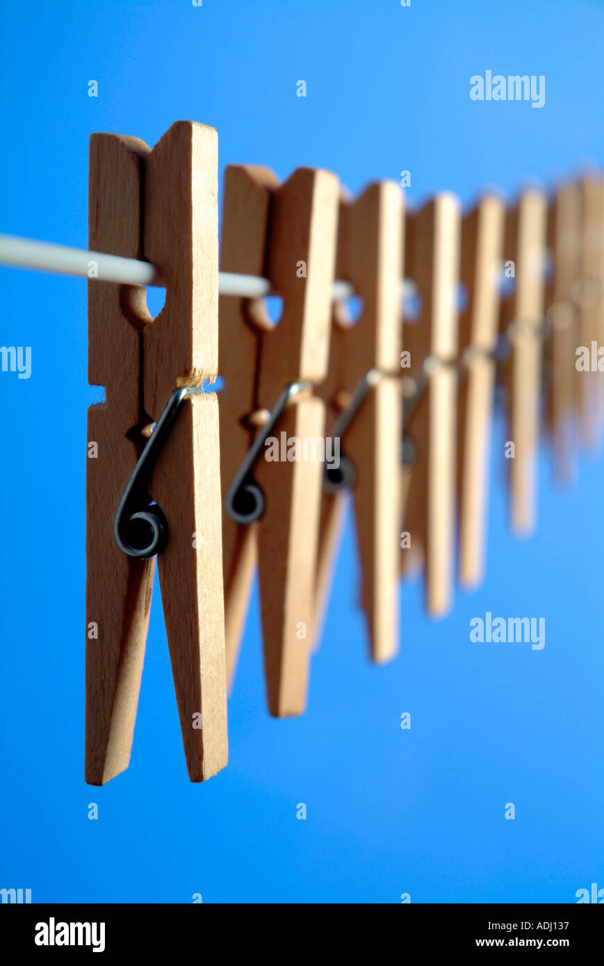 Wooden clothespegs on washing line Stock Photo - Alamy