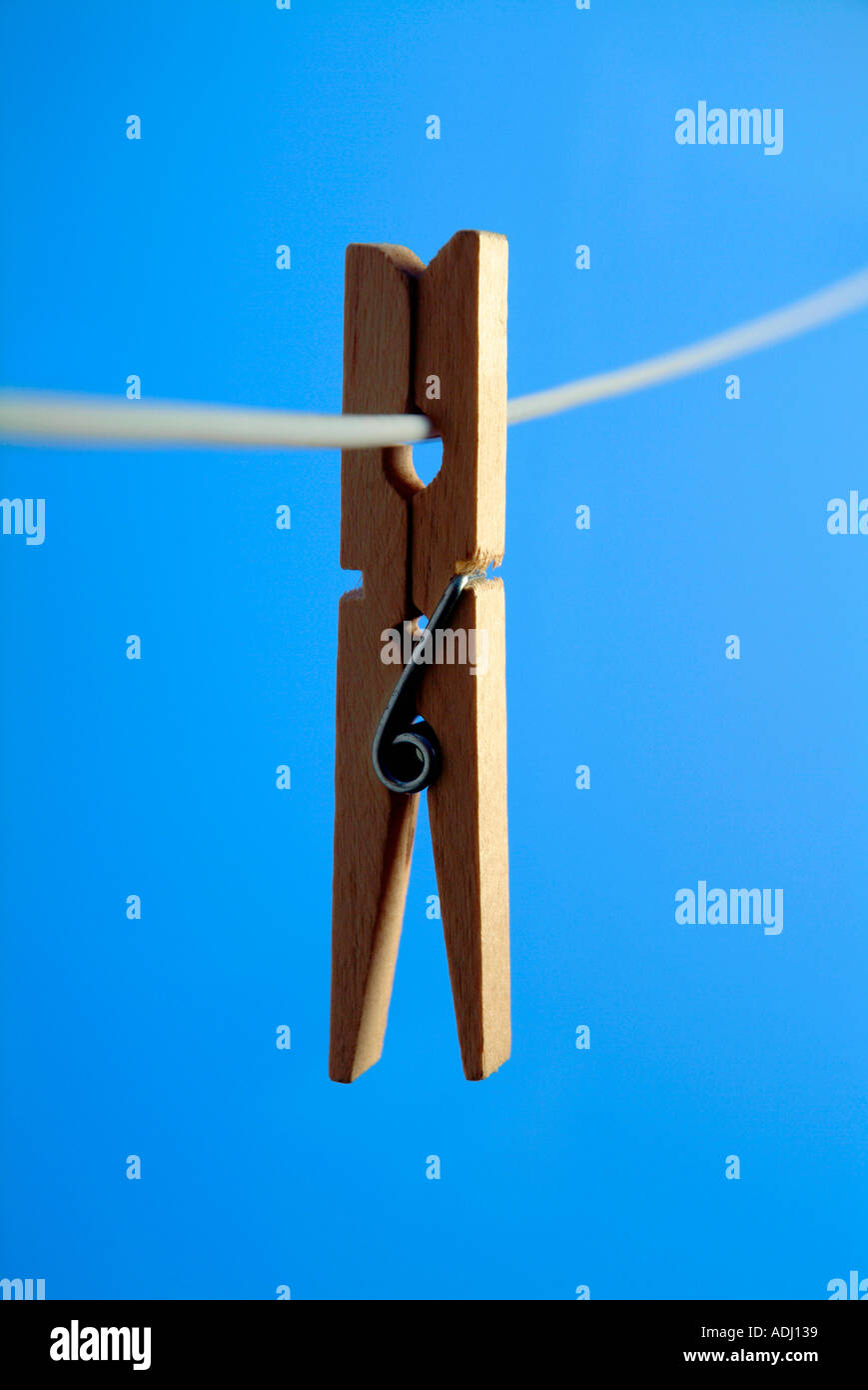 Wooden clothespeg on washing line Stock Photo