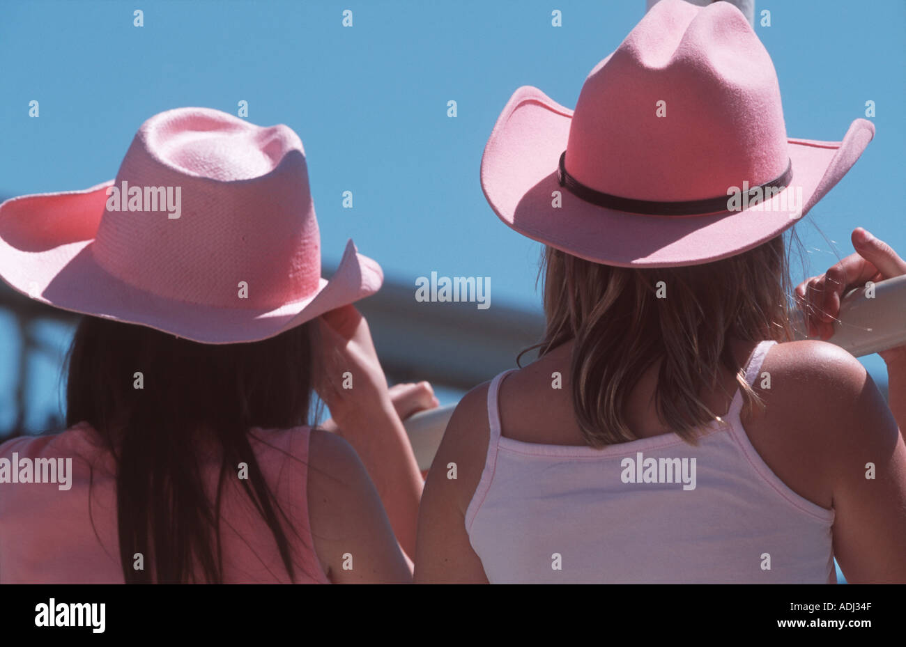 Girls in pink stetsons watching the Rodeo Calgary Stampede Calgary Alberta Canada Stock Photo