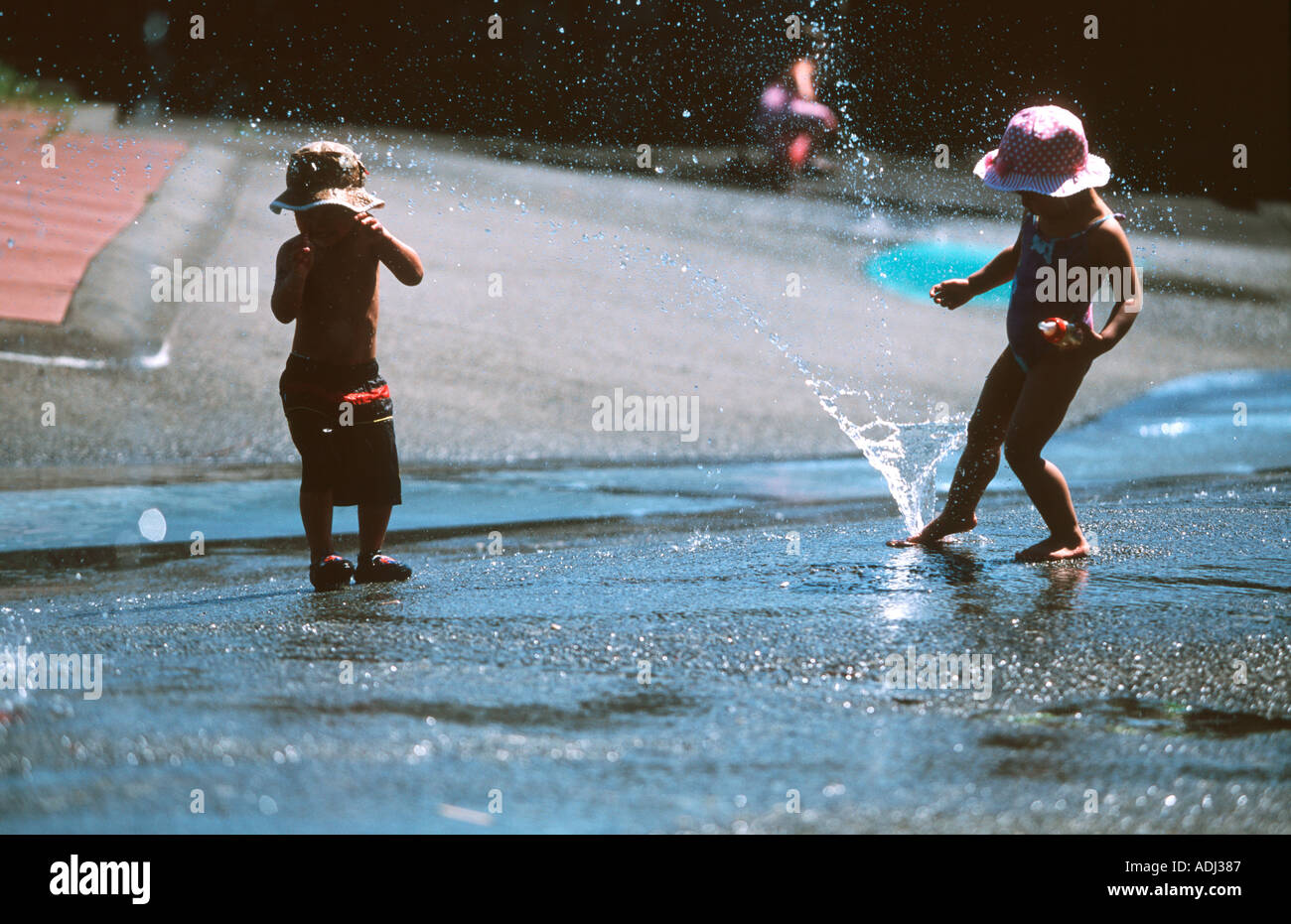 Children playing in the water fountains Stanley Park Vancouver Canada