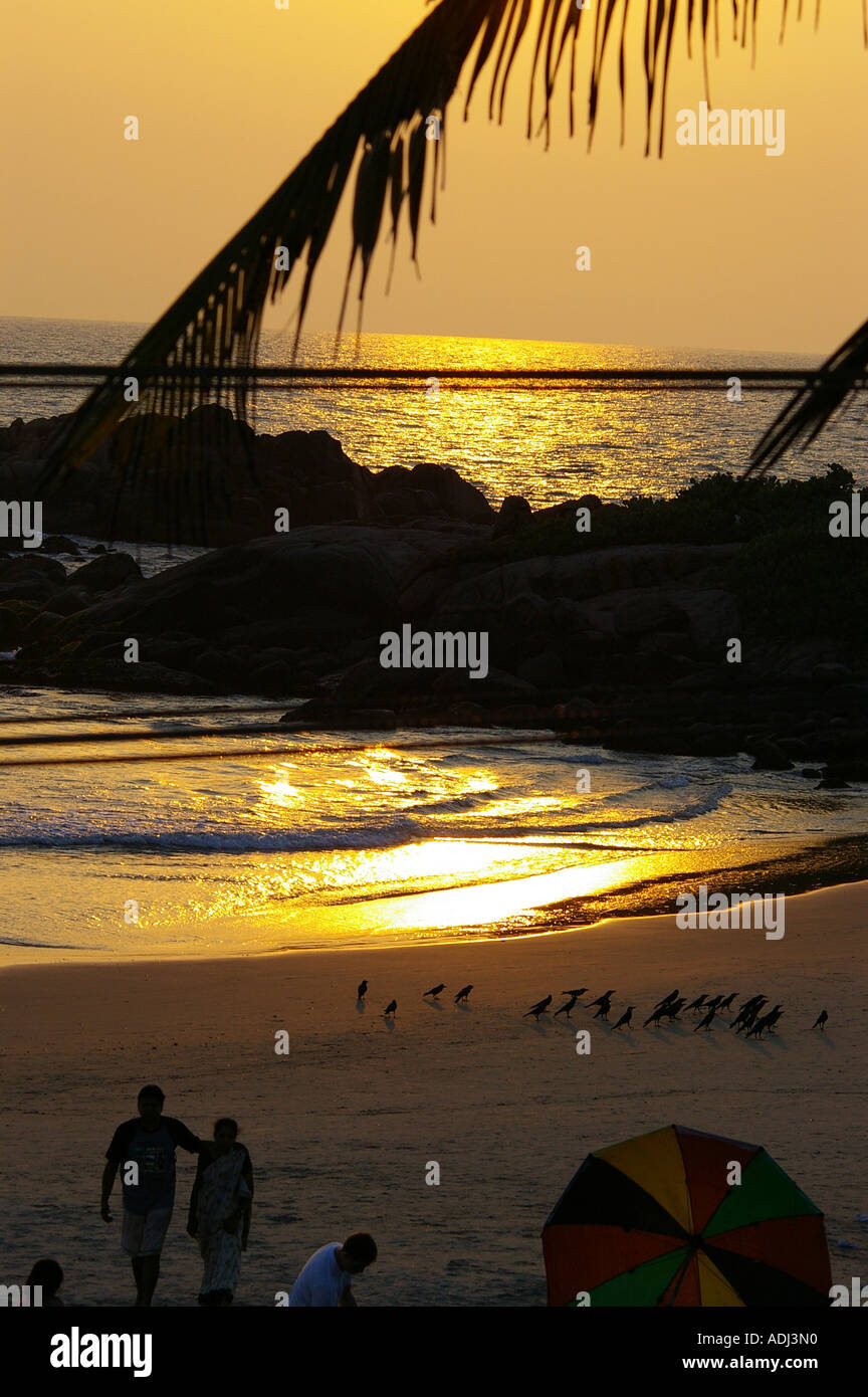 Kovalam beach Kerala sunset tourist tourists Stock Photo