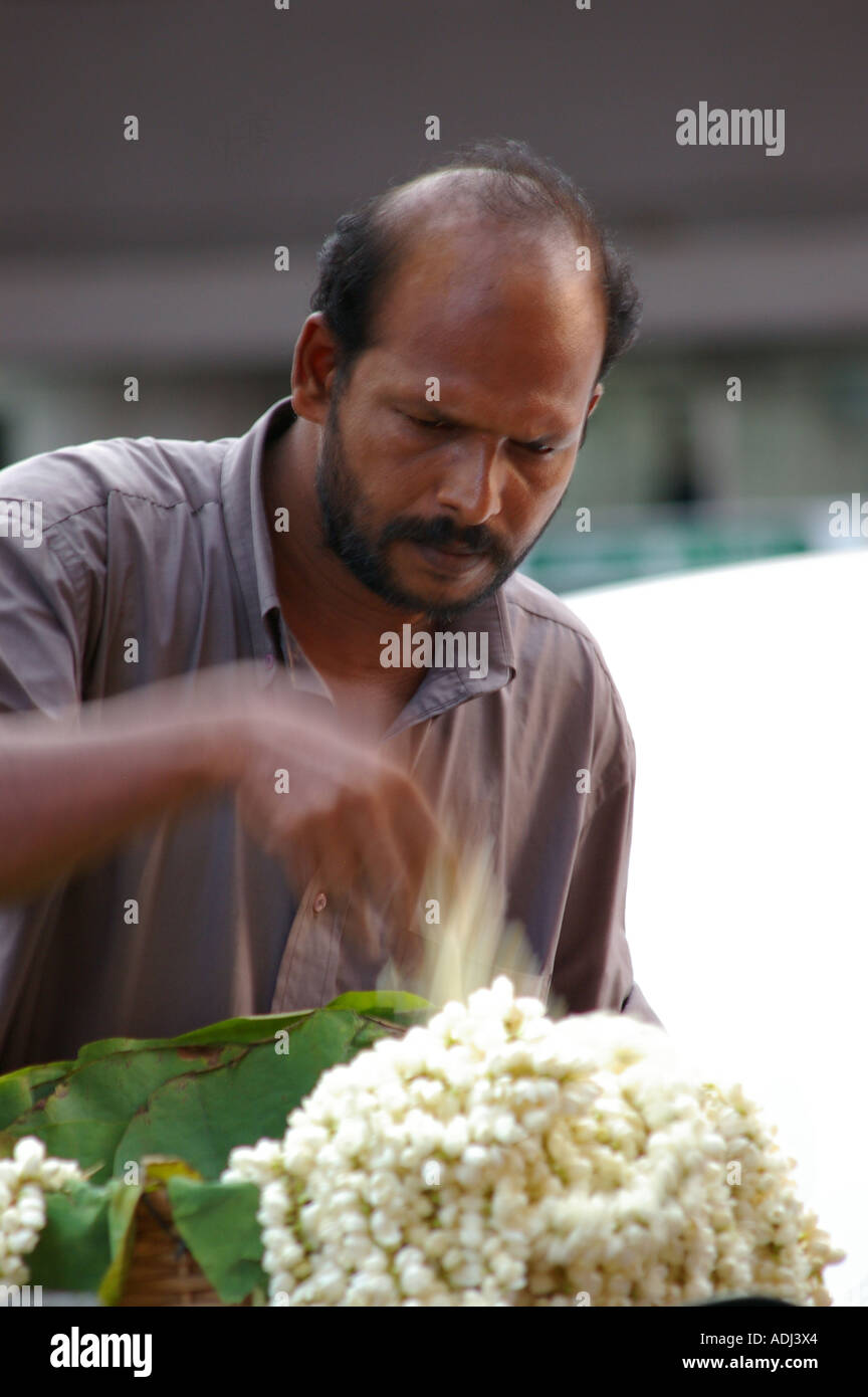 Man selling jasmine Trivandrum Thiruvananthapuram Kerala South India Stock Photo
