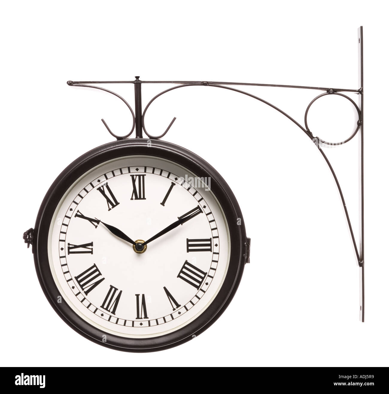 Wall mounted wall clock with roman numerals Stock Photo