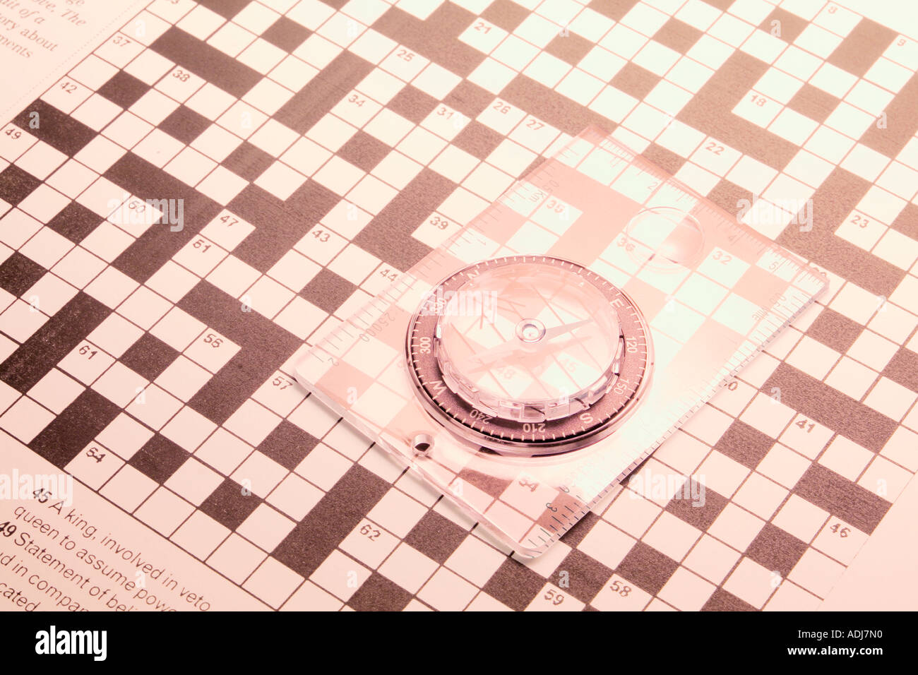Compass on Crossword Puzzle Stock Photo Alamy