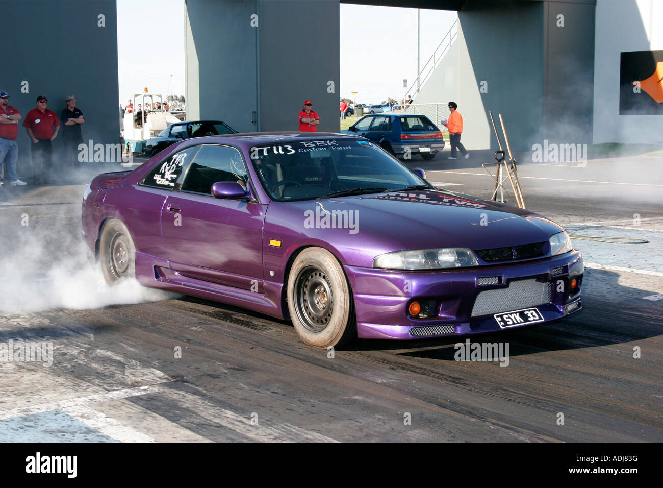 Modified Japanese R33 Nissan Skyline car performing a tyre warming burnout  prior to a quarter mile drag race Stock Photo - Alamy