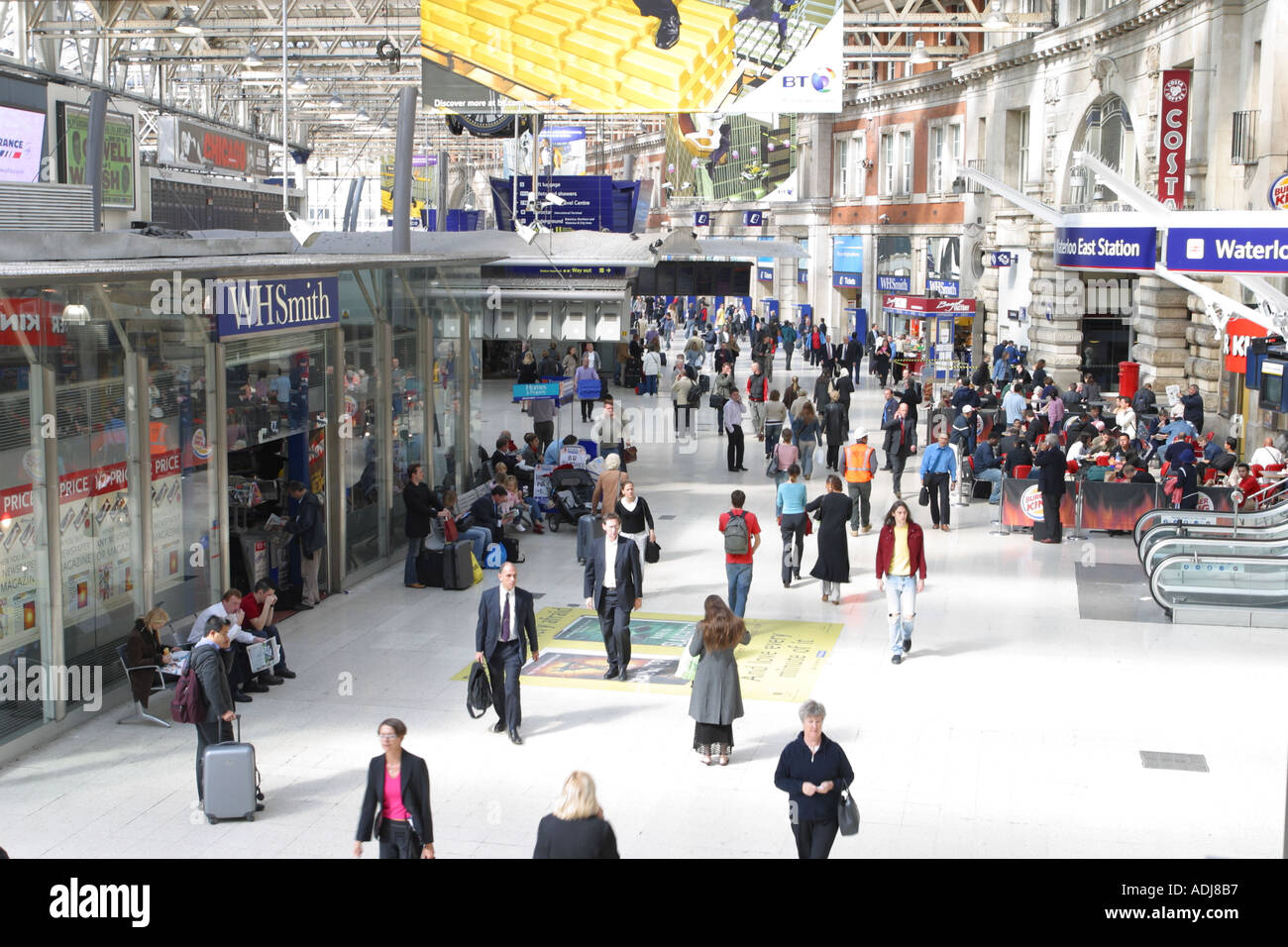 London Waterloo Passengers commuters and shoppers on the busy concourse at Waterloo railway station London Stock Photo