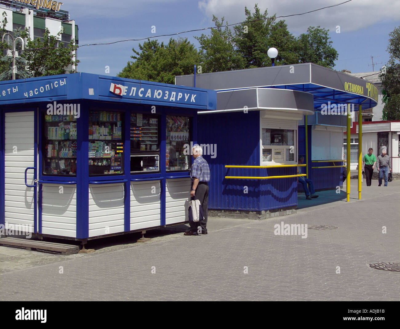 Three outdoor kiosks, toiletries kiosk in foreground, bus ticket office kiosk next, unidentified white kiosk therafter, Station Road, Gomel, Belarus Stock Photo