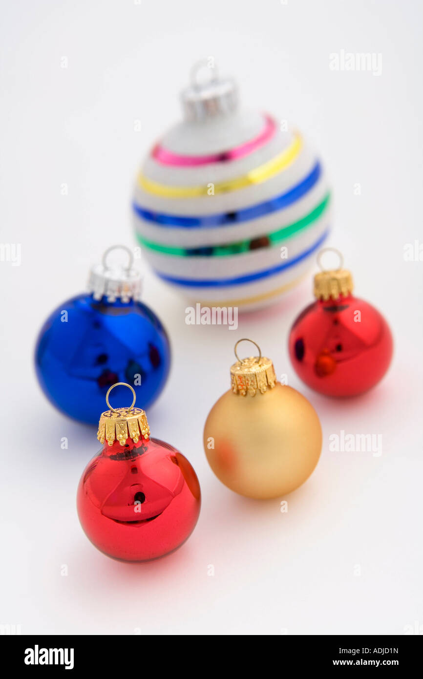 Multiple colorful Christmas tree bulb ornaments placed on white background studio portrit Stock Photo
