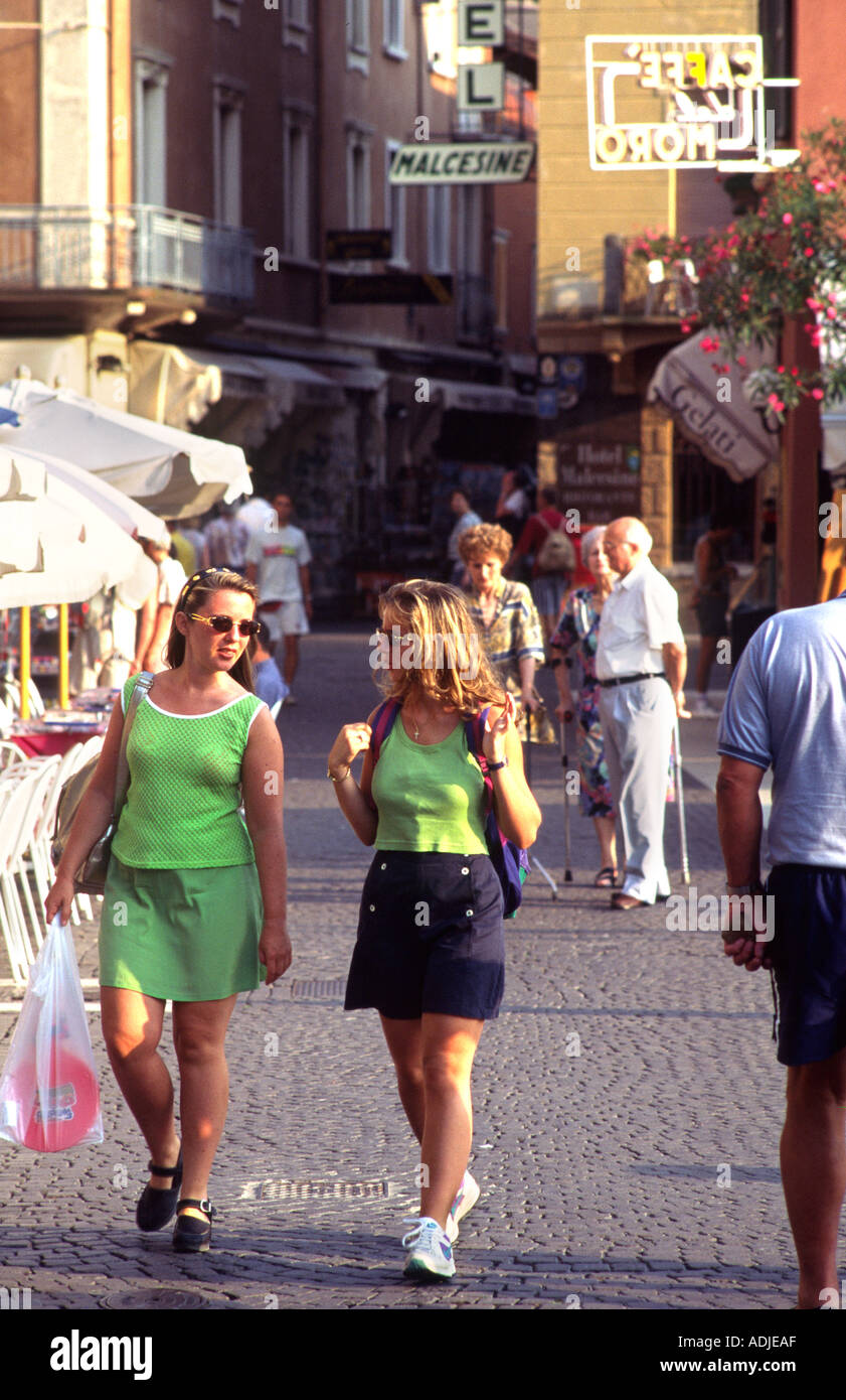 Two girls walking down street hi-res stock photography and images - Alamy