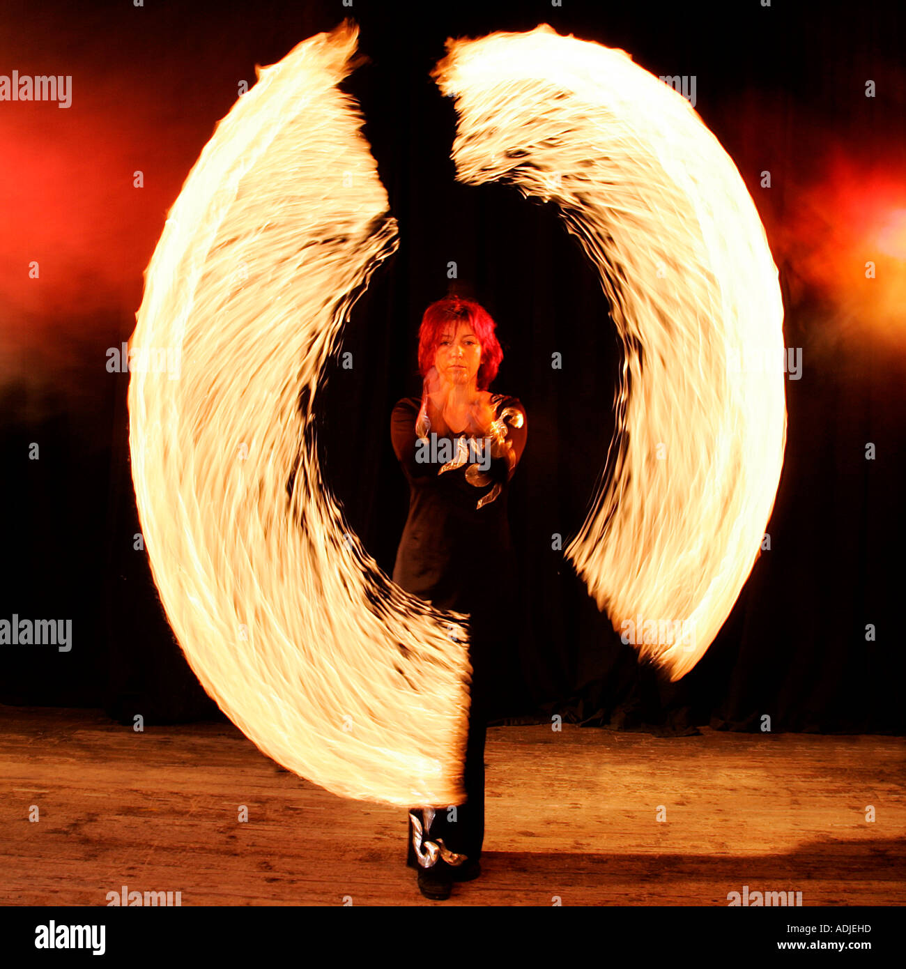 confusion danger ballerina ballet dancer actress stage performance challenge fire abstract modern absurd artistic balance Stock Photo