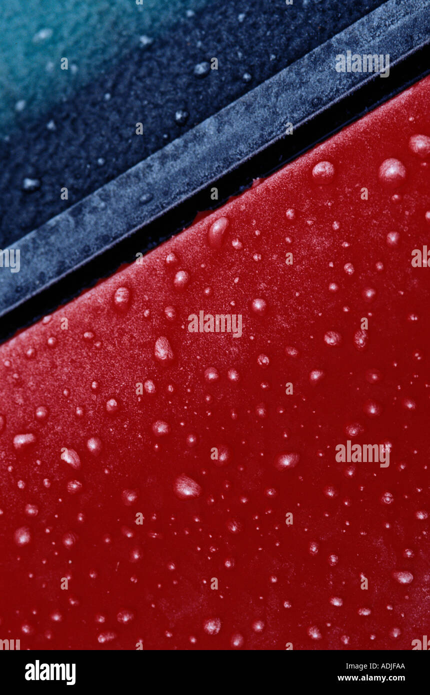 Frozen raindrops on a red car Stock Photo