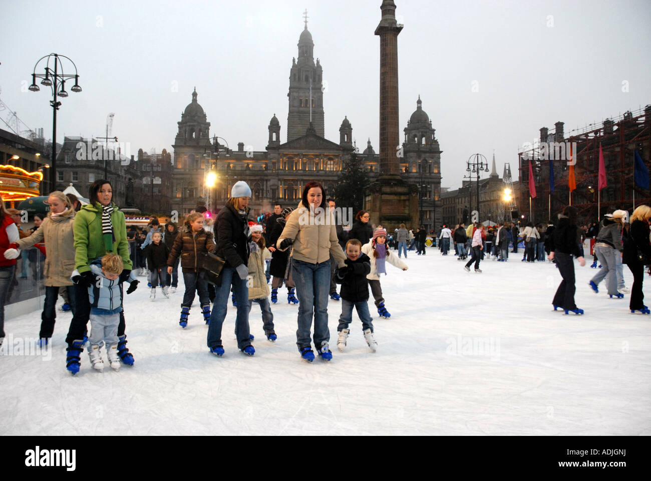 Ice Skating on Outdoor Ice Rink, George Square. City Chambers in Background. Glasgow. Scotland. Xmas 2006 Stock Photo