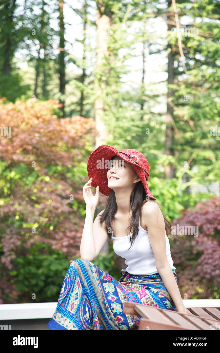 woman sitting on the bench of the park Stock Photo - Alamy