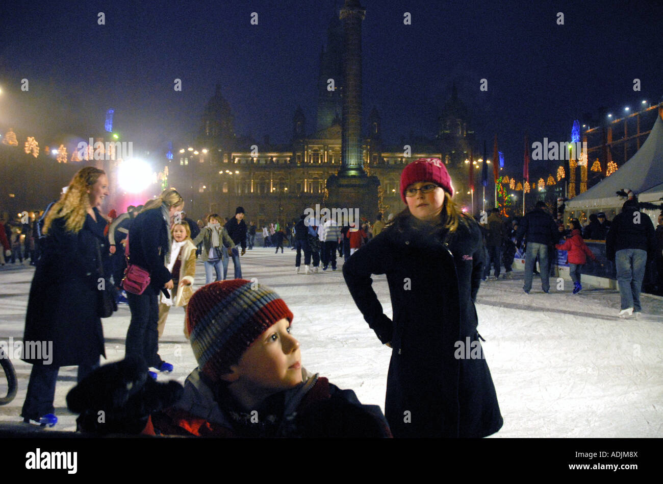 Ice Skating on Outdoor Ice Rink, Square. City Chambers in