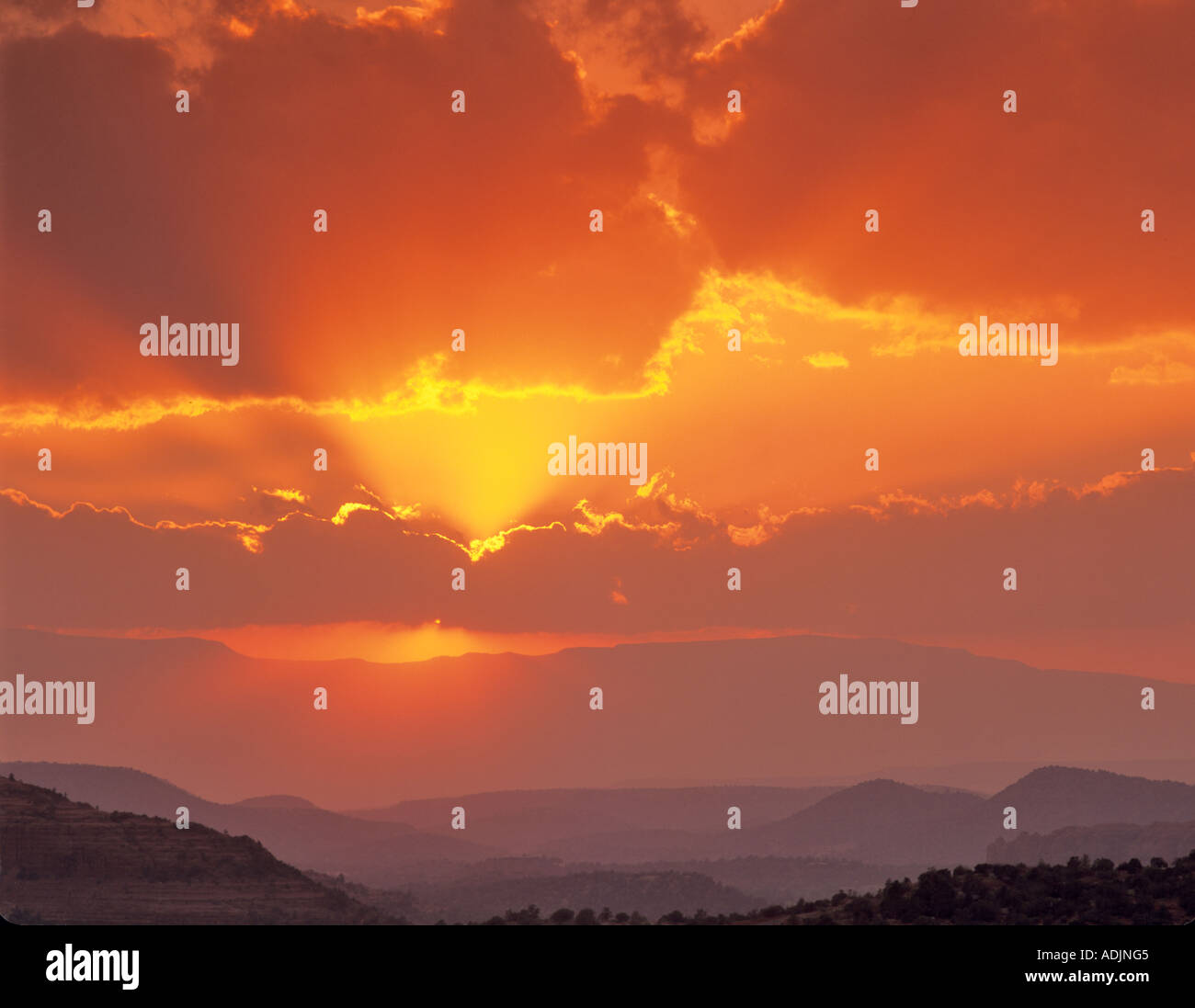 Sunset clouds with sun rays Near Sedona Arizona Stock Photo