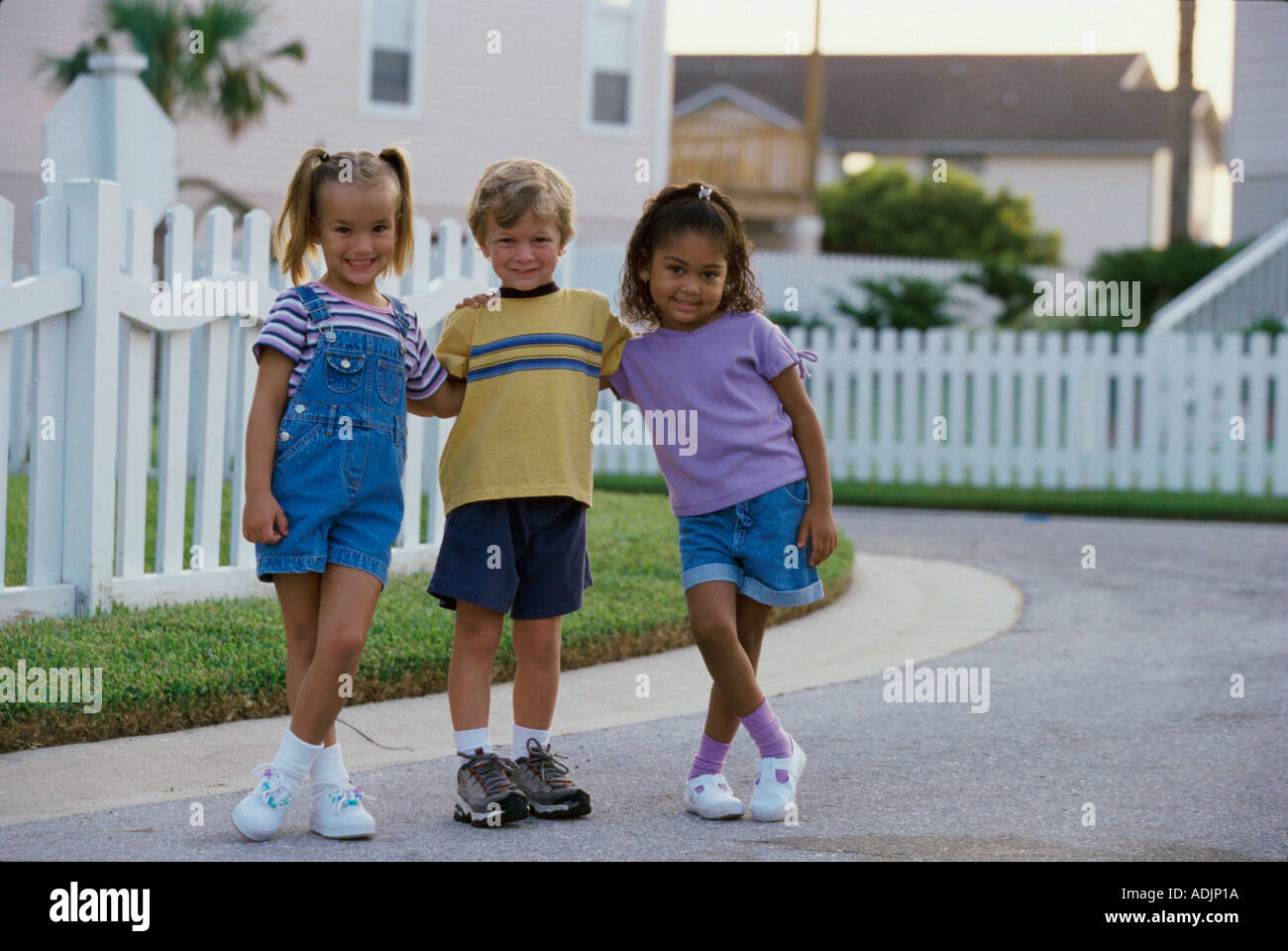 Portrait of two girls and a boy standing together Stock Photo - Alamy