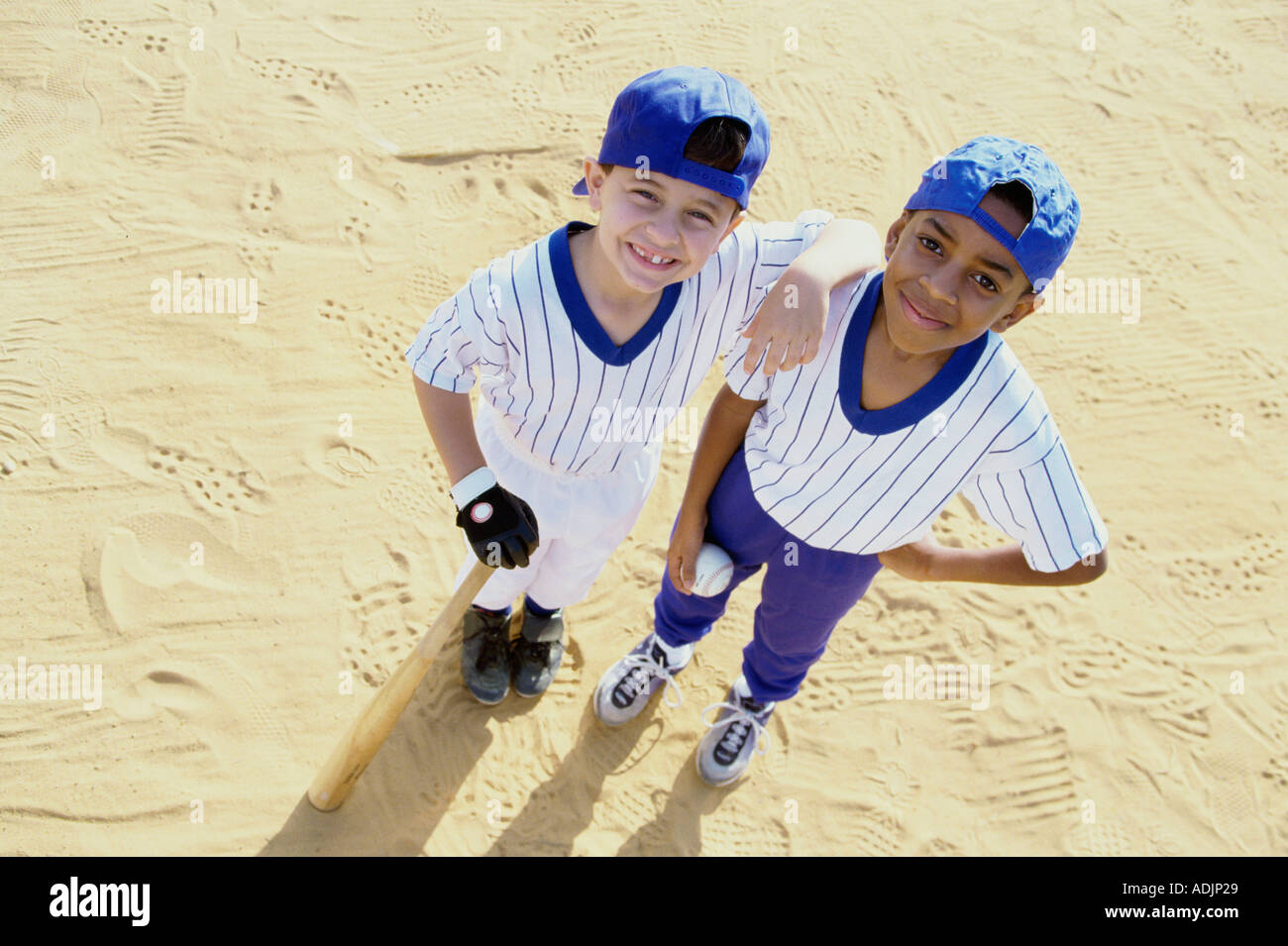 Portrait of two boys in baseball uniforms Stock Photo Alamy
