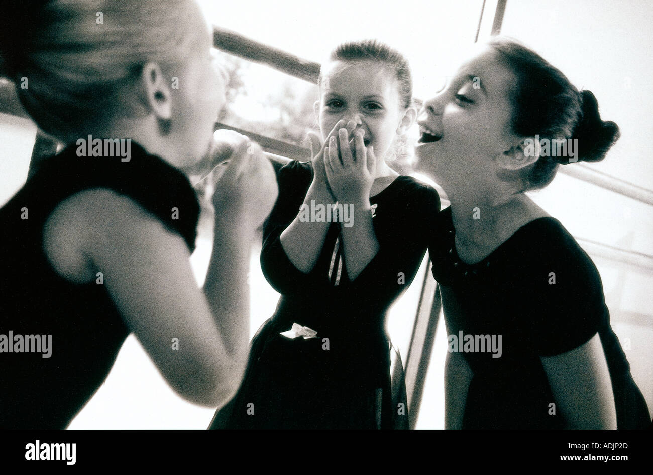 Three ballerinas laughing Stock Photo - Alamy