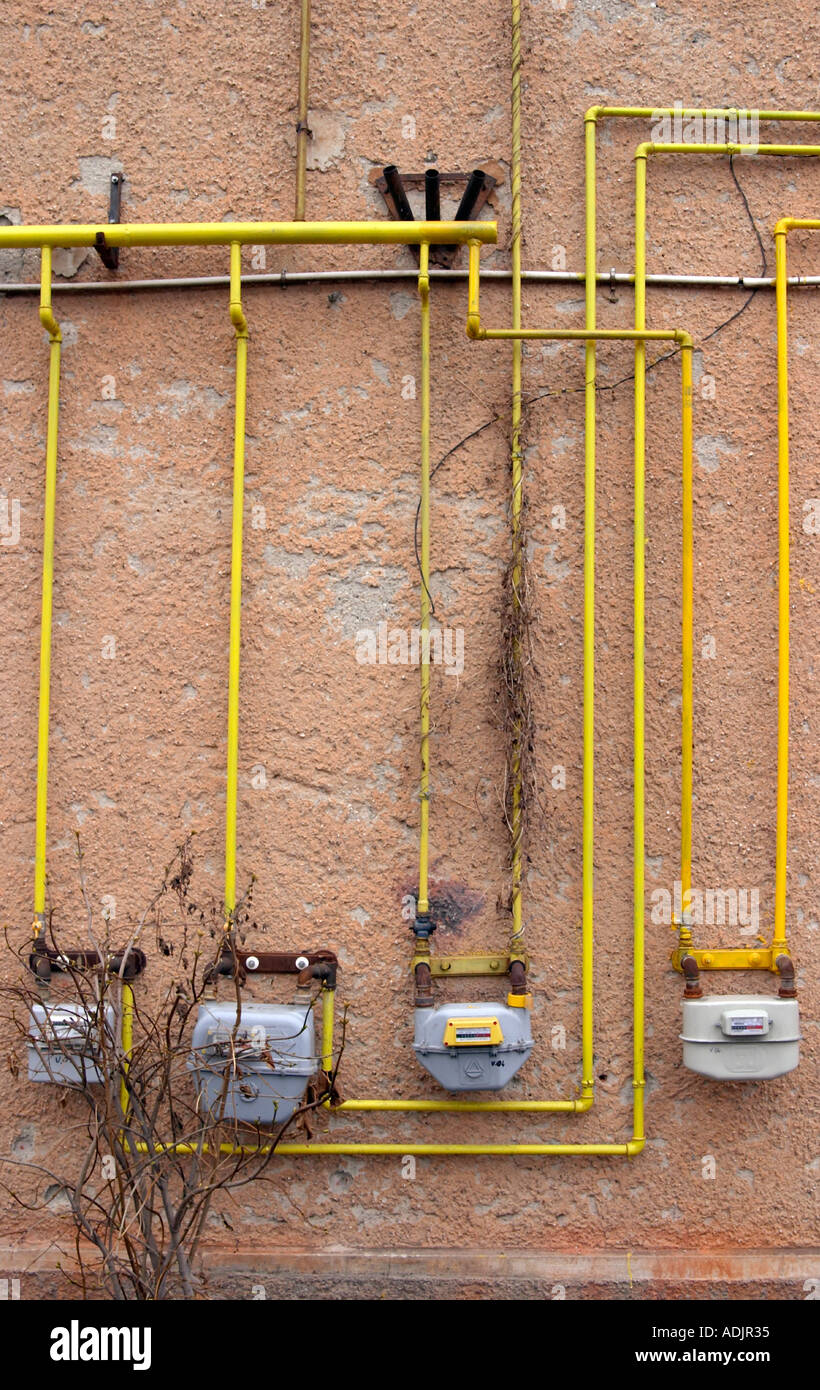 yellow gas pipes on a public building in Brasov Romania Stock Photo