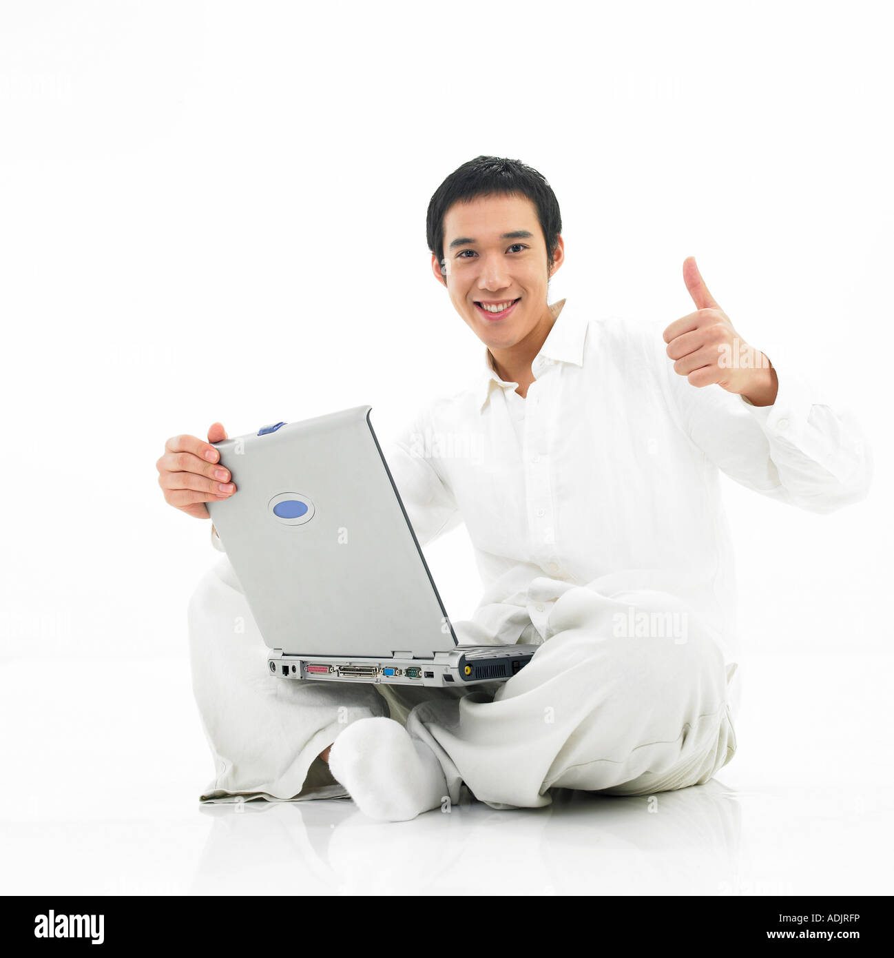 A man is making a thumb up with a notebook computer Stock Photo - Alamy