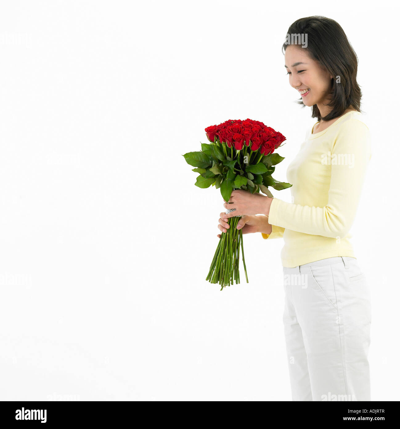 A woman is holding a bouquet Stock Photo