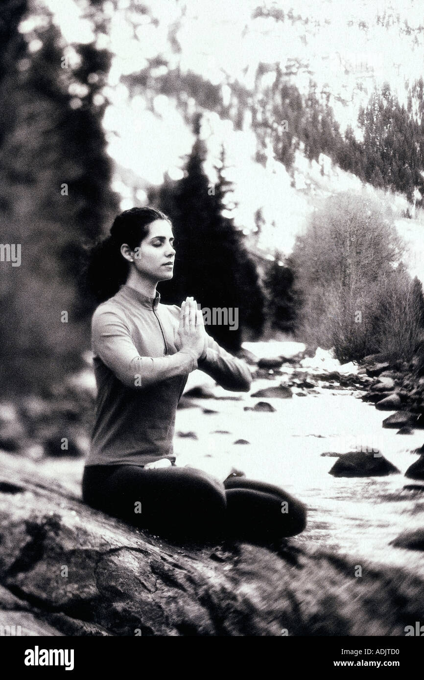 Young woman meditating in the lotus position Stock Photo