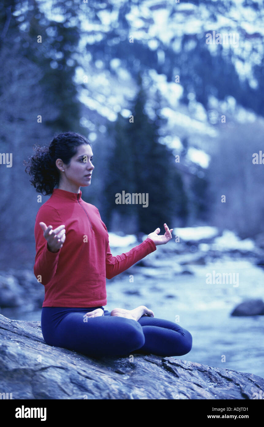 Young woman meditating in the lotus position Stock Photo