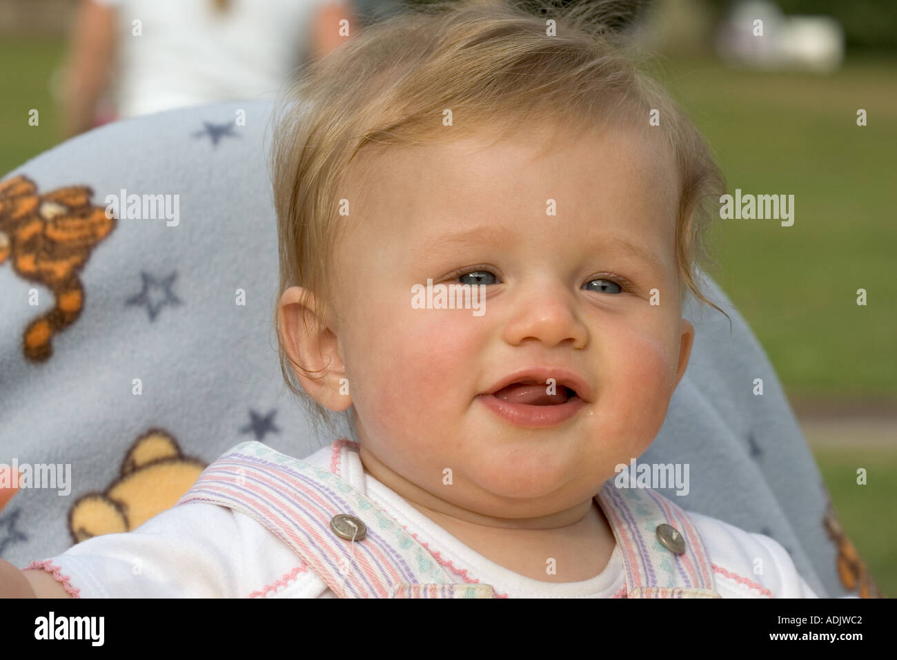 Happy 6 month old baby Holly in high chair waiting to be fed UK Stock Photo Alamy