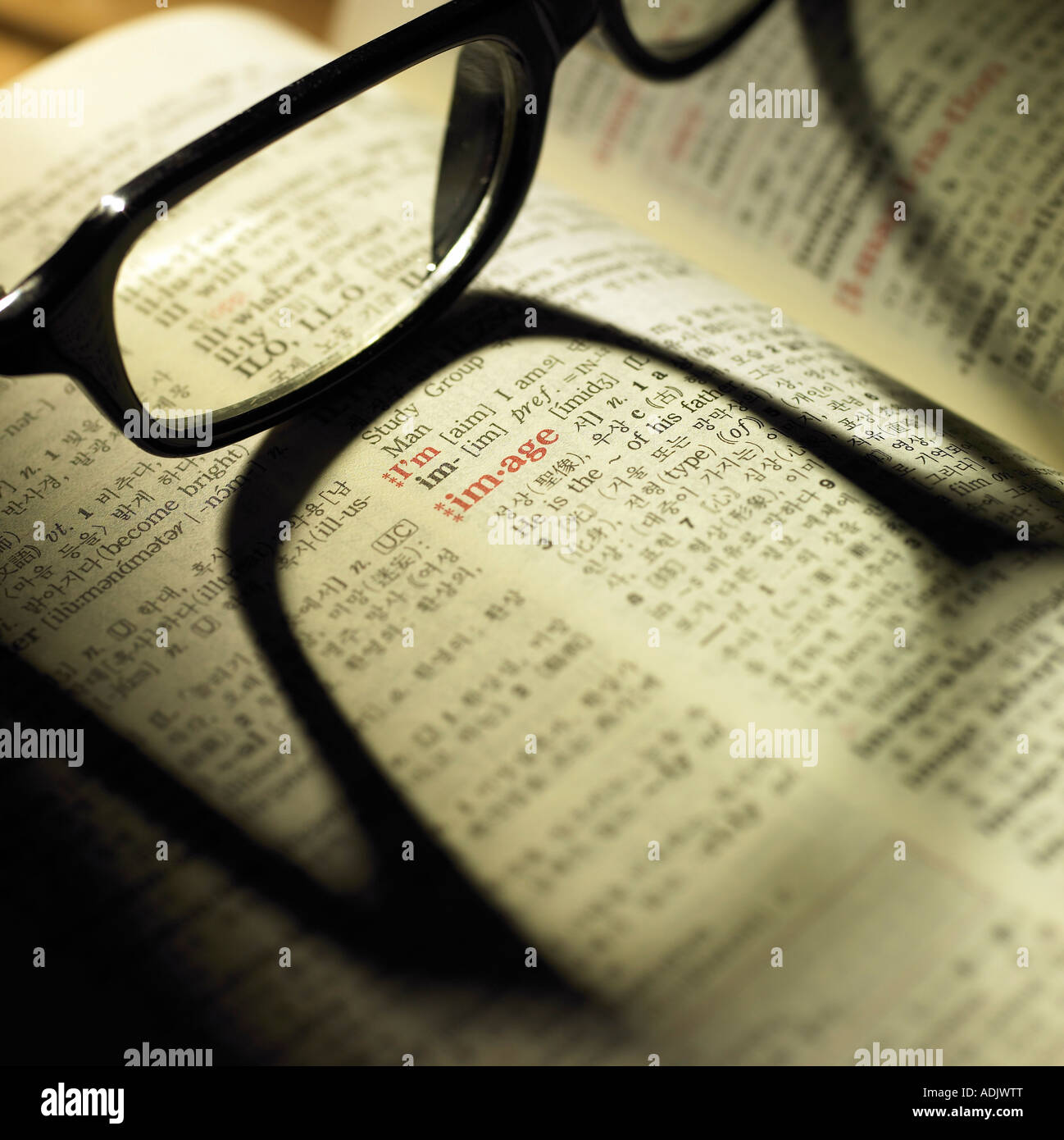 Glasses on a opened English dictionary Stock Photo Alamy