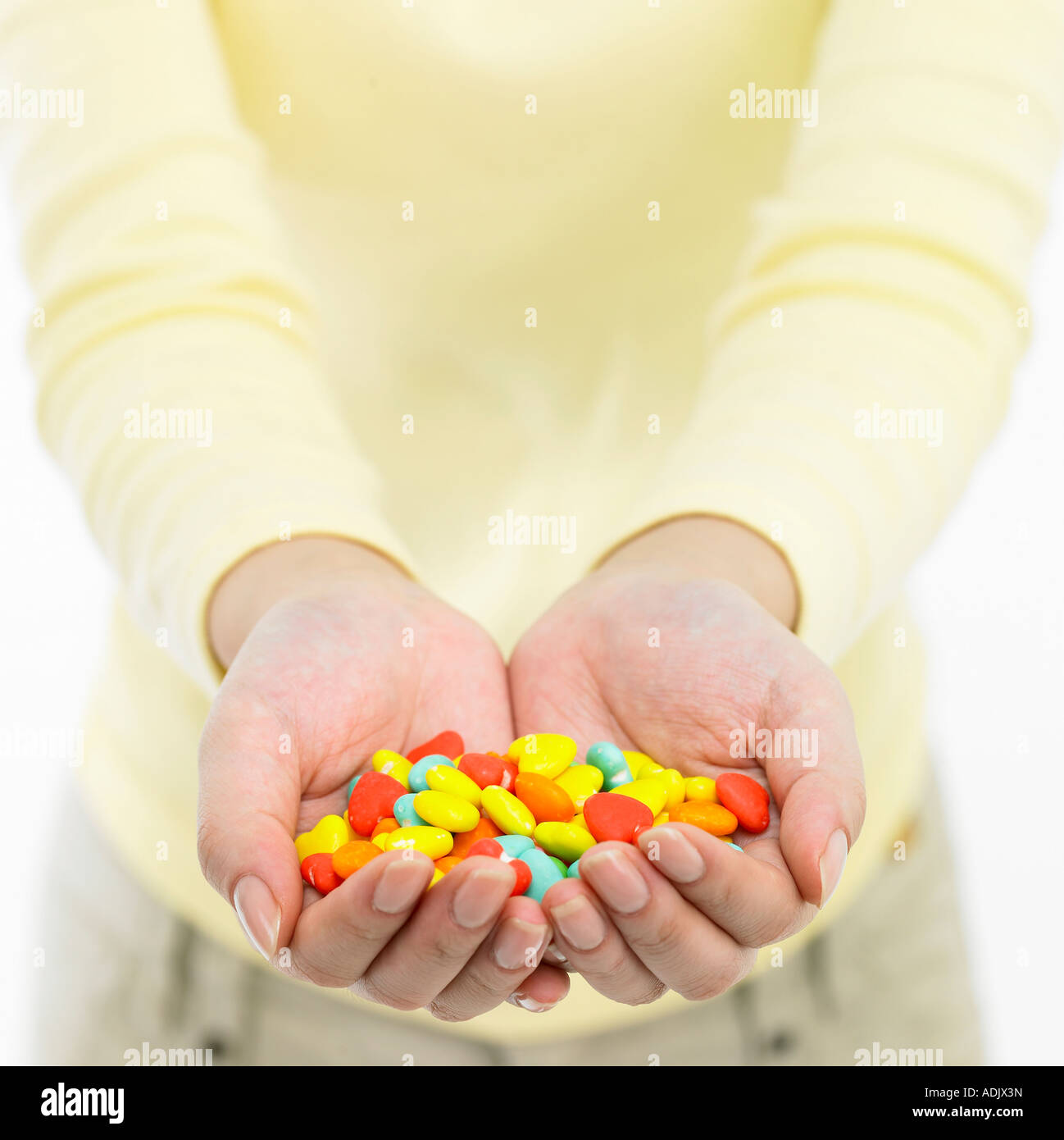 Hand full of sweets hi-res stock photography and images - Alamy