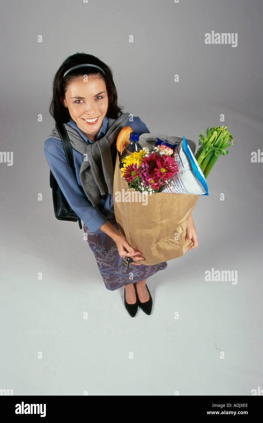 Portrait of a young woman carrying a grocery bag Stock Photo Alamy