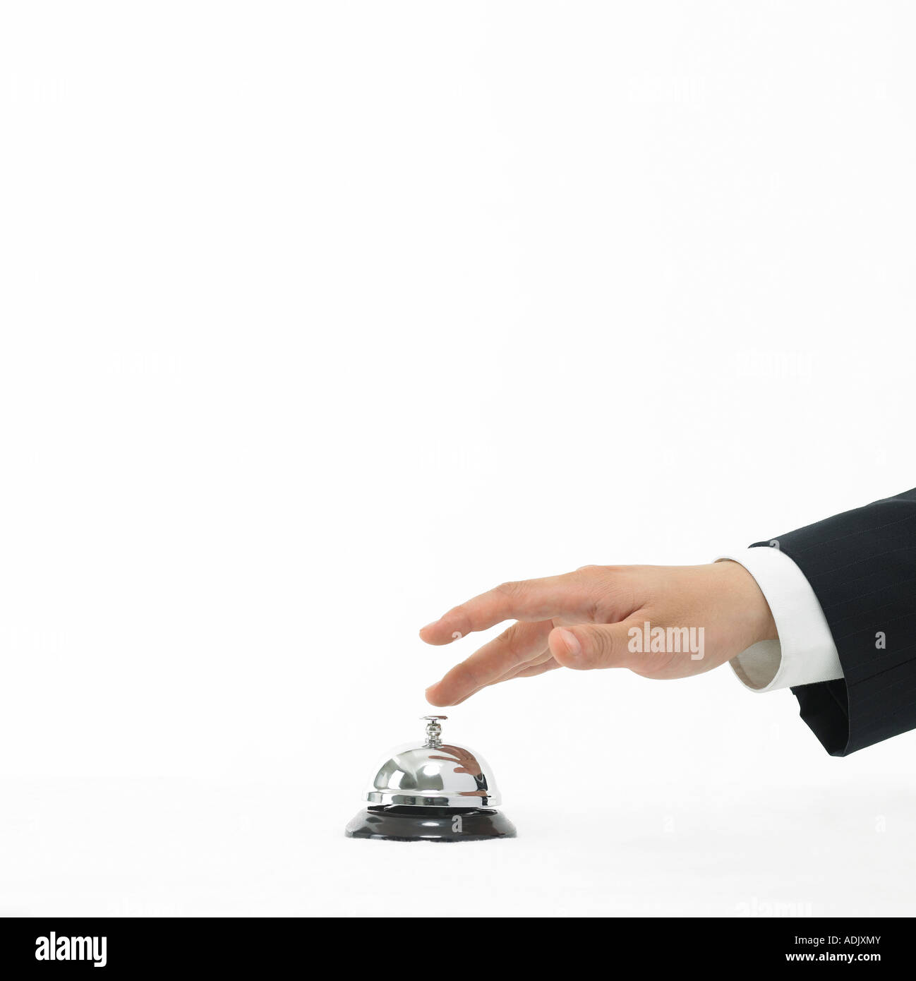 A hand touching a chime bell Stock Photo Alamy