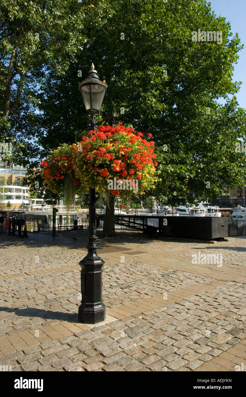 hanging flower baskets on a lamp post london Stock Photo - Alamy