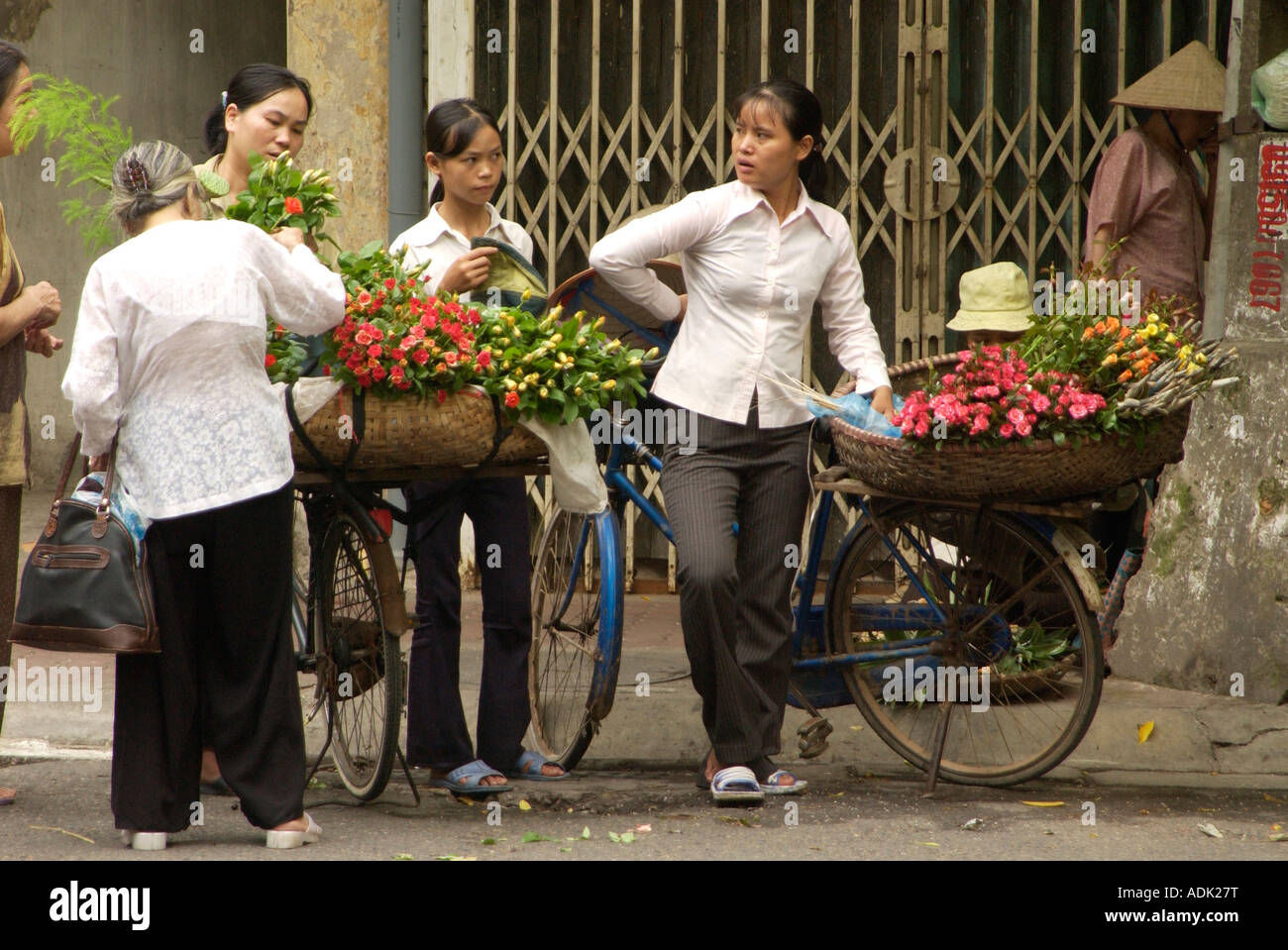 Women sell flowers on the street in Hanoi Vietnam Stock Photo Alamy