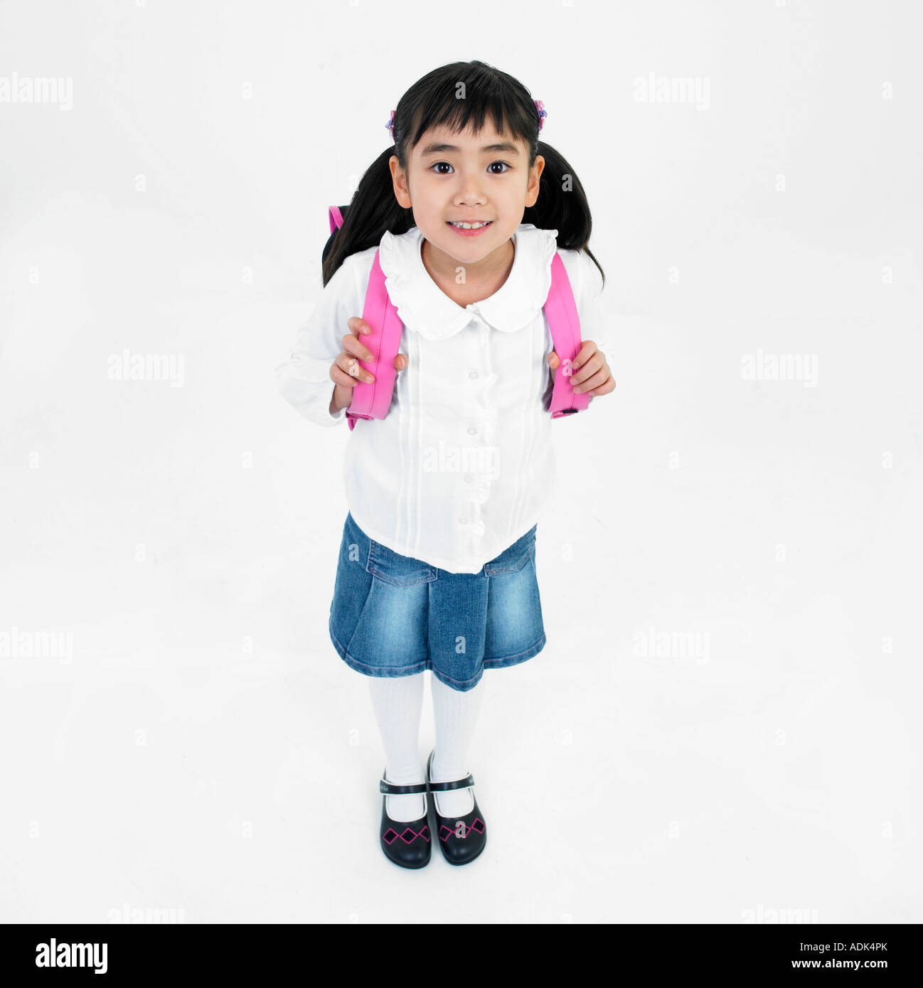 a girl carrying a school bag over her shoulder Stock Photo Alamy