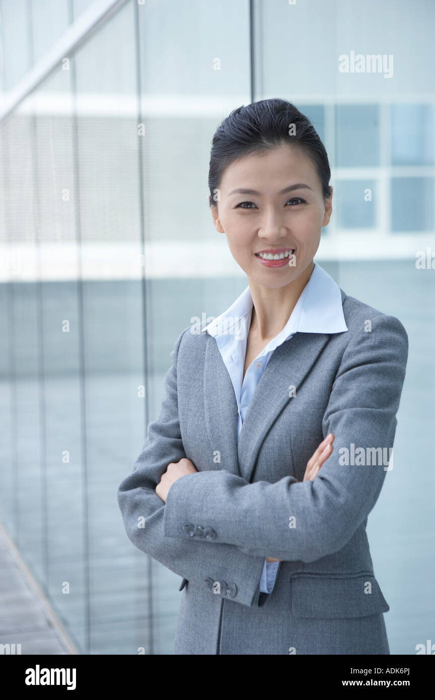 a businesswoman folding her arms Stock Photo - Alamy