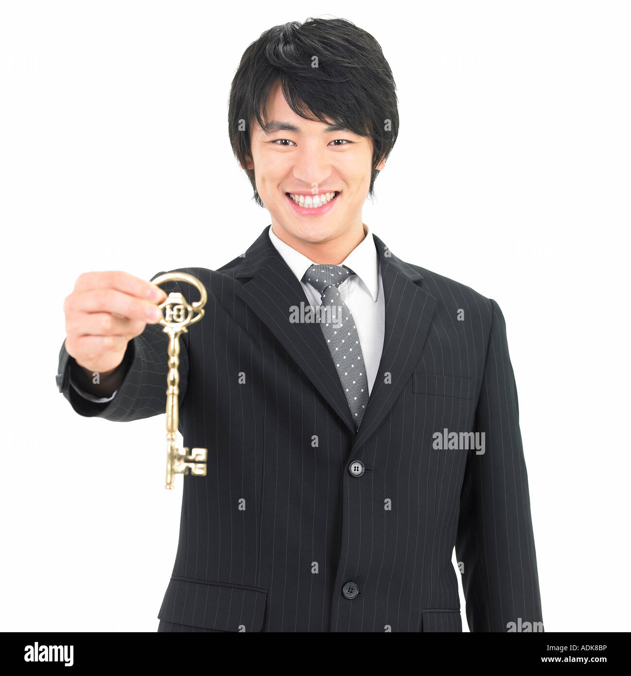 Businessman holding golden key hi-res stock photography and images - Alamy