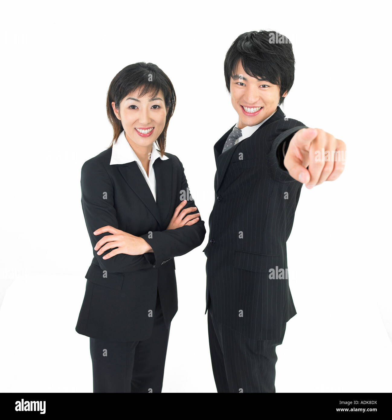 a businesswoman and a businessman making a gesture Stock Photo