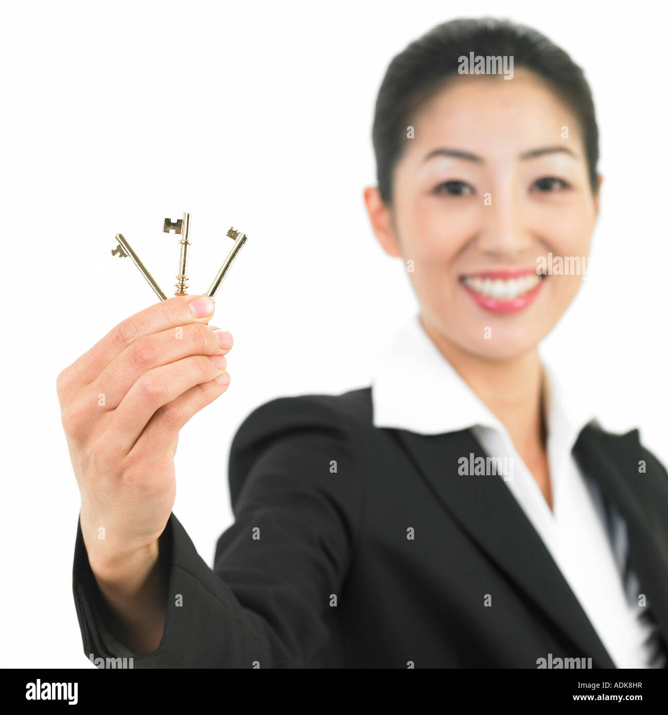 a businesswoman holding keys Stock Photo - Alamy