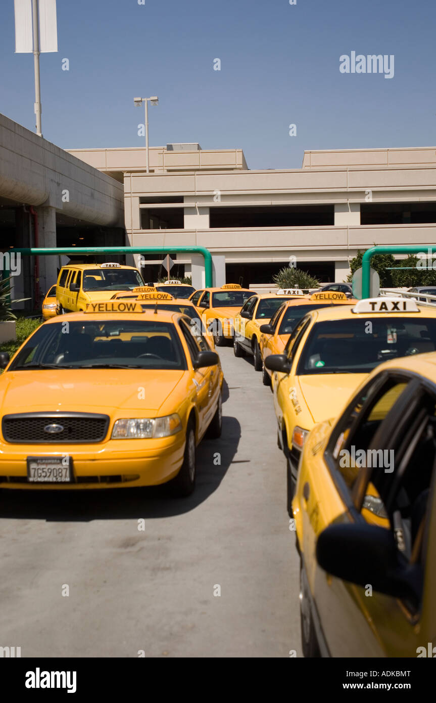 Taxi cabs line up to pick up arriving passengers at the Orange County