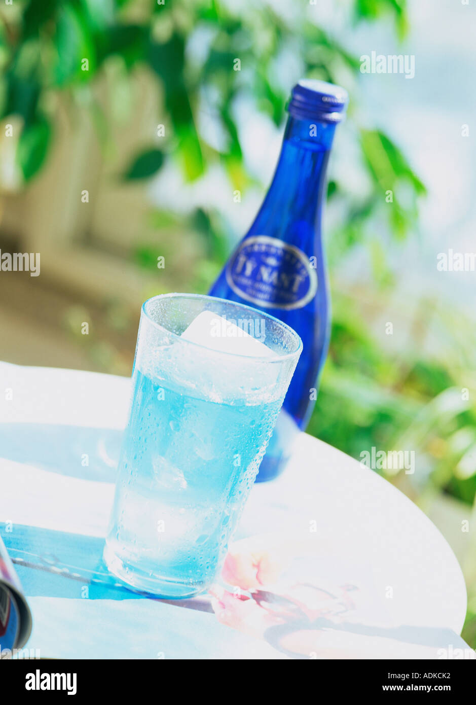 drink beverage blue Hawaii cocktail and wine bottle Stock Photo