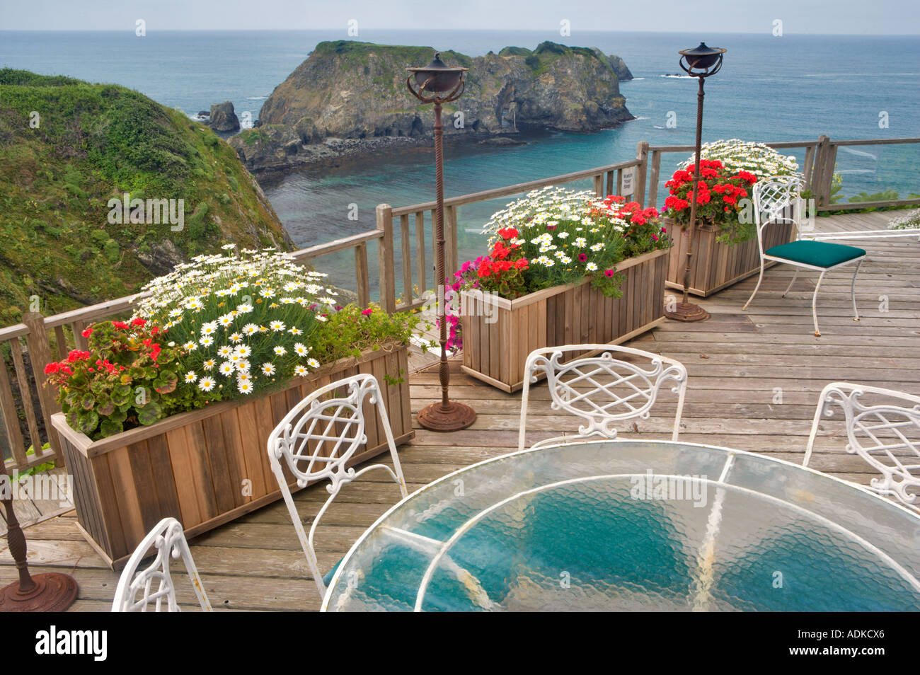 View of ocean deck with table and flowers Greenwood Pier Elk California Stock Photo