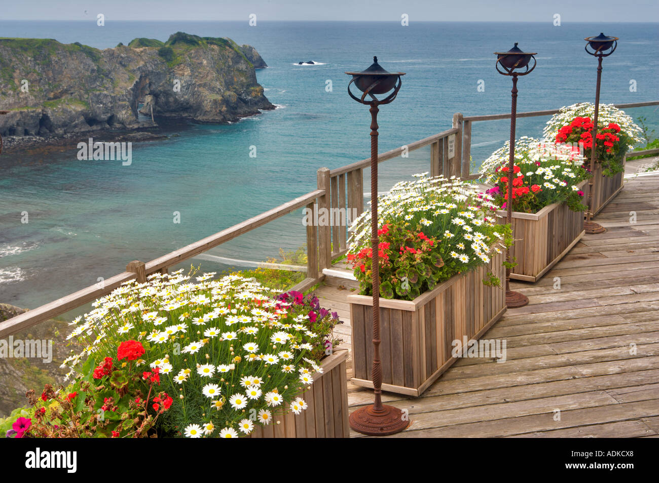 View of ocean deck with flower benches and lanterns Greenwood Pier Elk Californai Stock Photo