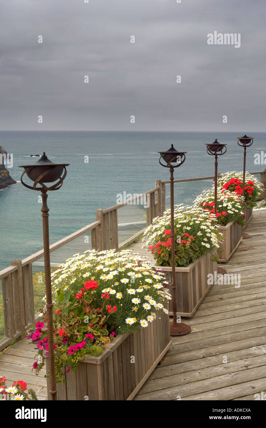 View of ocean deck with flower benches and lanterns Greenwood Pier Elk Californai Stock Photo