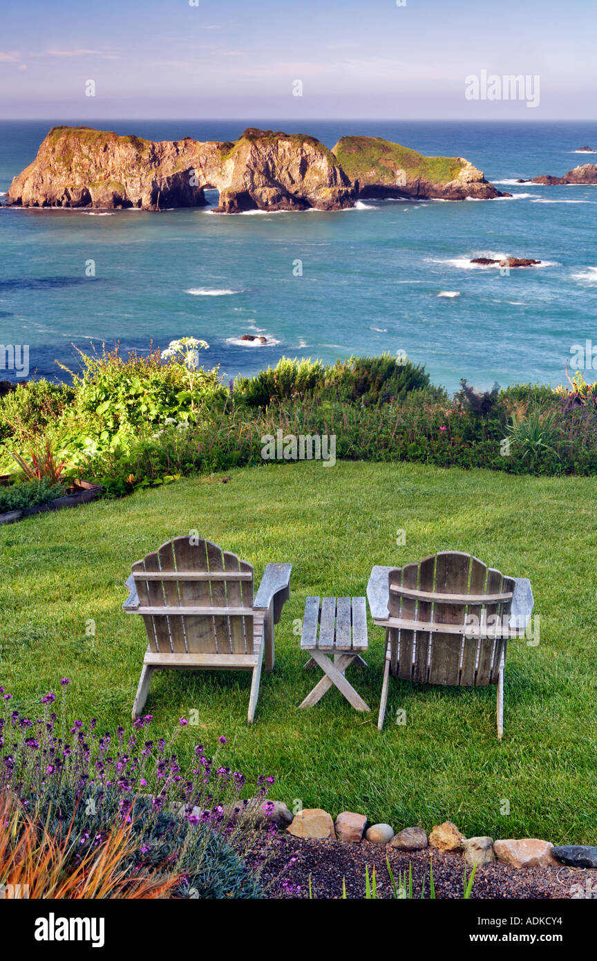 Two chairs on grass overlook at The Harbor House Inn Elk California Stock Photo