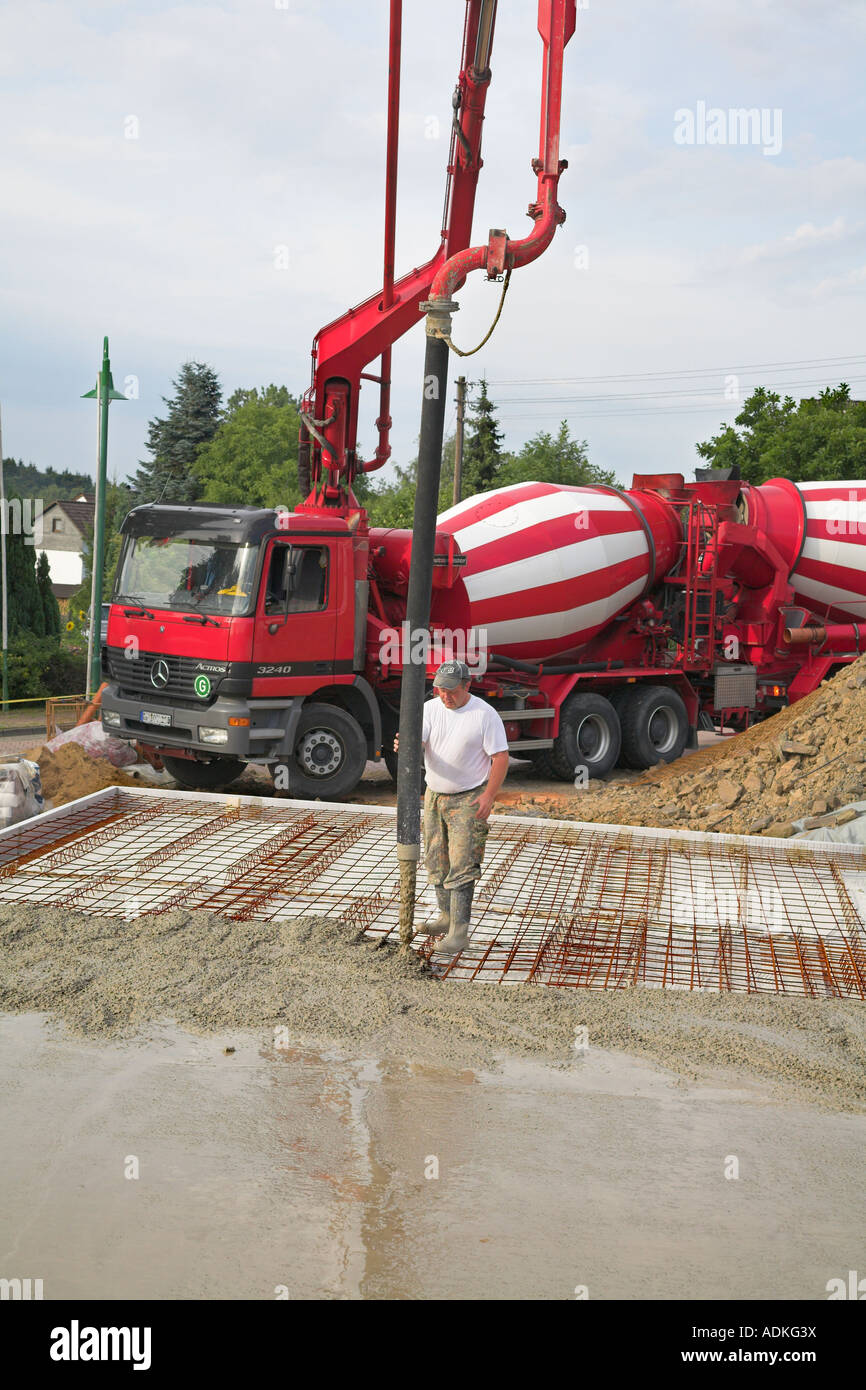 Cement trucks delivering premixed concrete to a building site. Germany