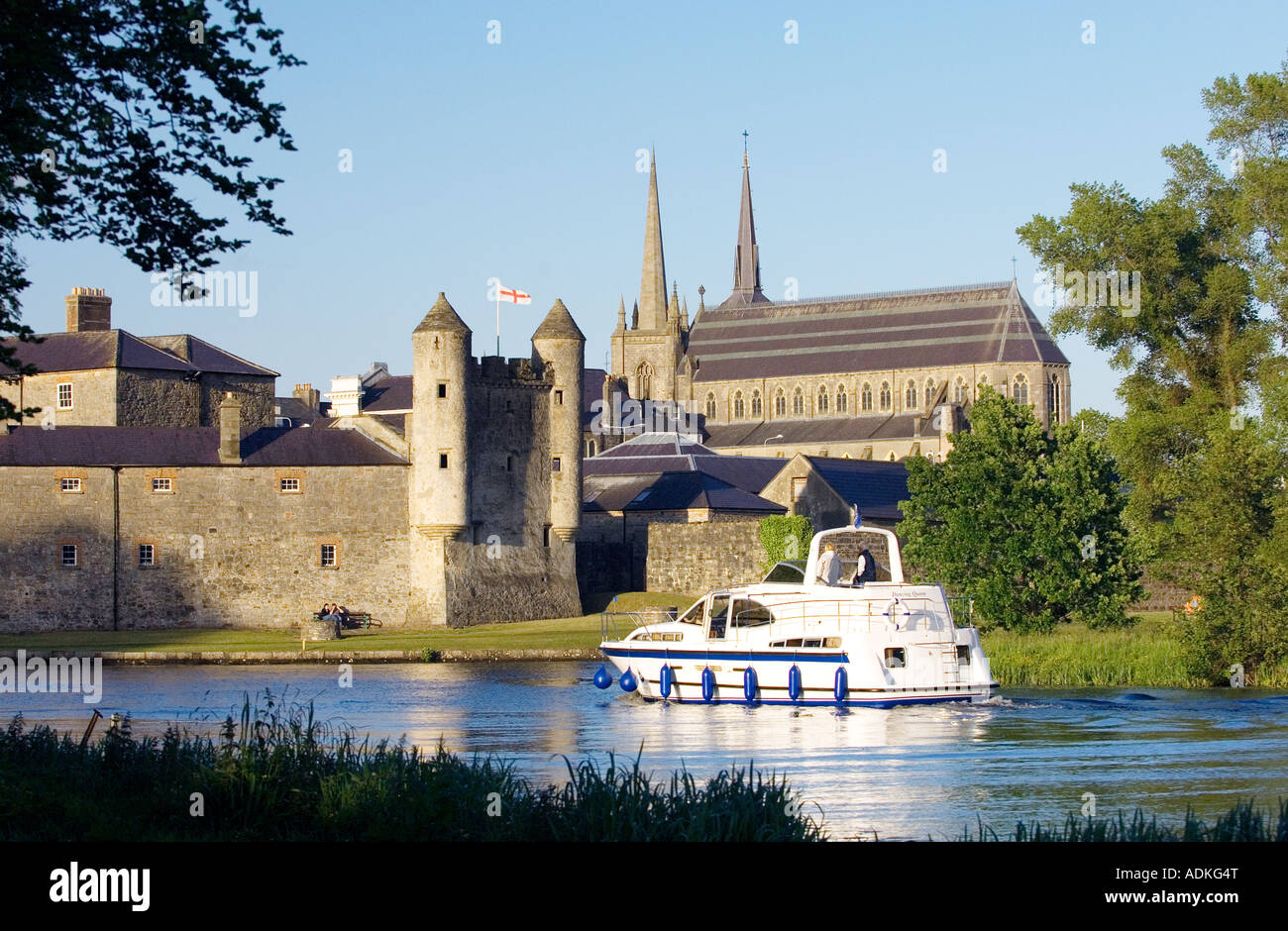 Pleasure boat on River Erne waterway passing Enniskillen Castle and St